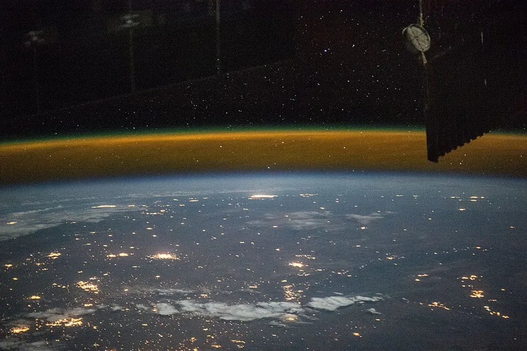 What is the barrier between Earth and space called?, Layers Delineating