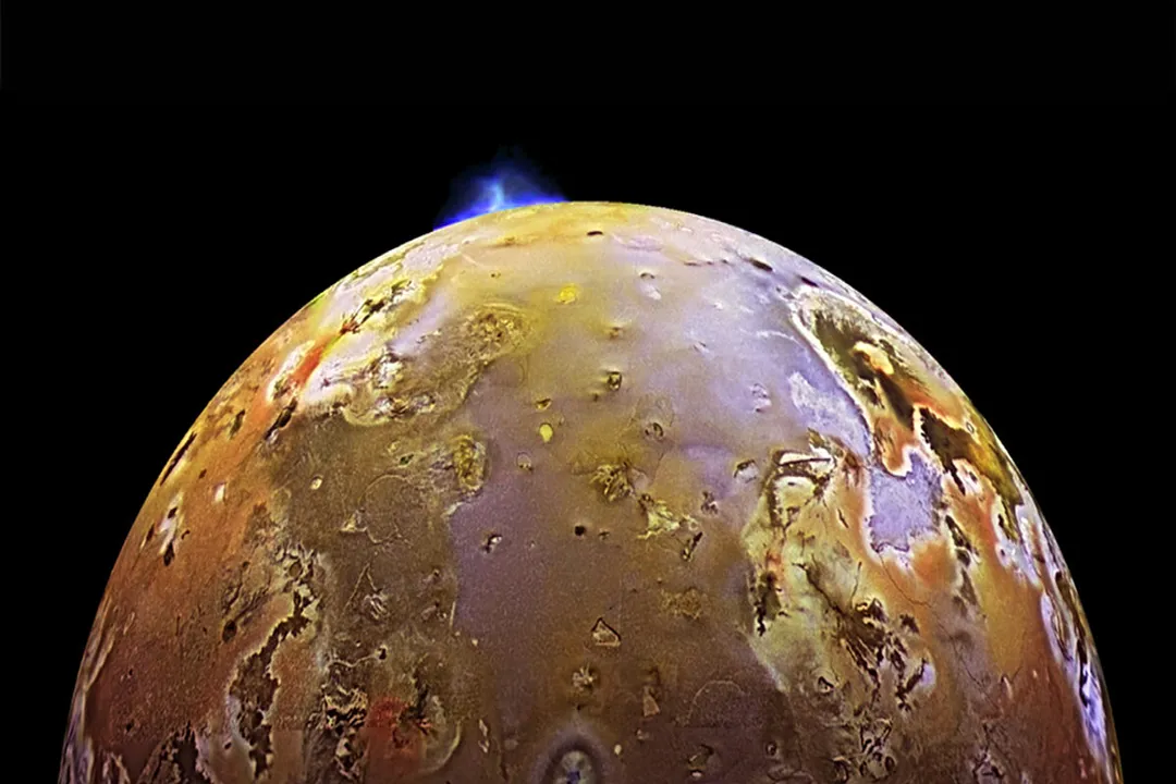 Why does Io display more geological activity than Jupiter's other moons?