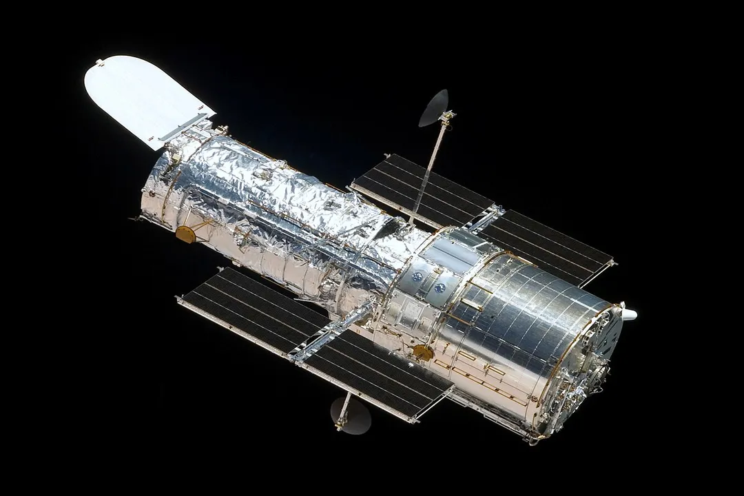 What do Hubble's cameras observe in the universe?, Wavelength Reach