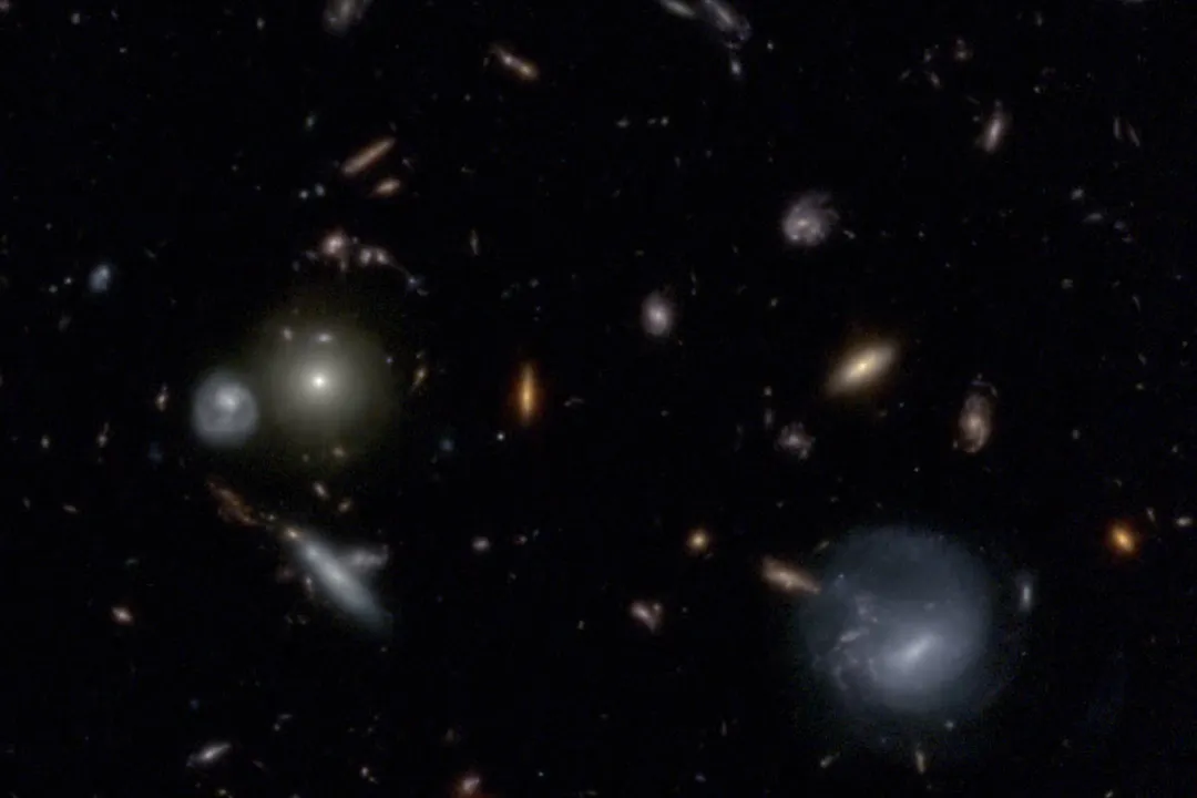 Why is it helpful to look at very distant galaxies to study galaxy formation and evolution over cosmic time?