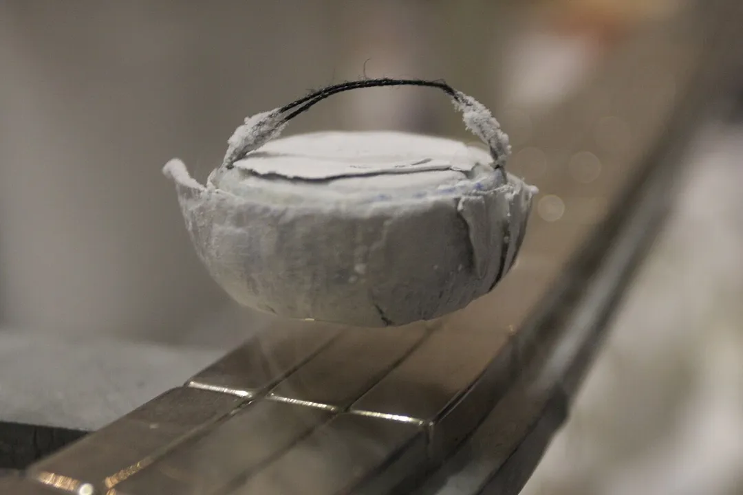 How do superconductors achieve zero resistance?