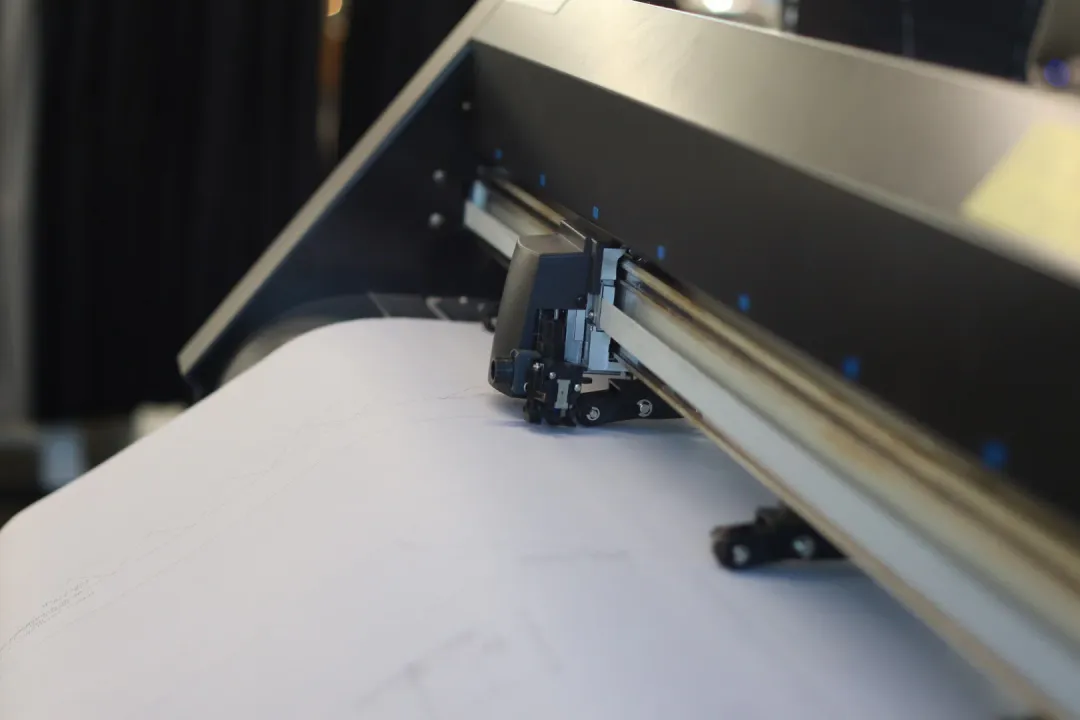 What invention led to mass production of clothing?