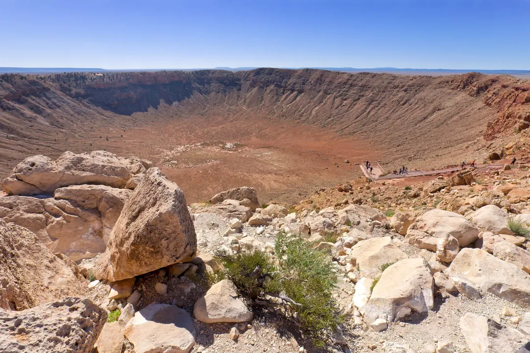 What's the main reason that scientists study asteroids?