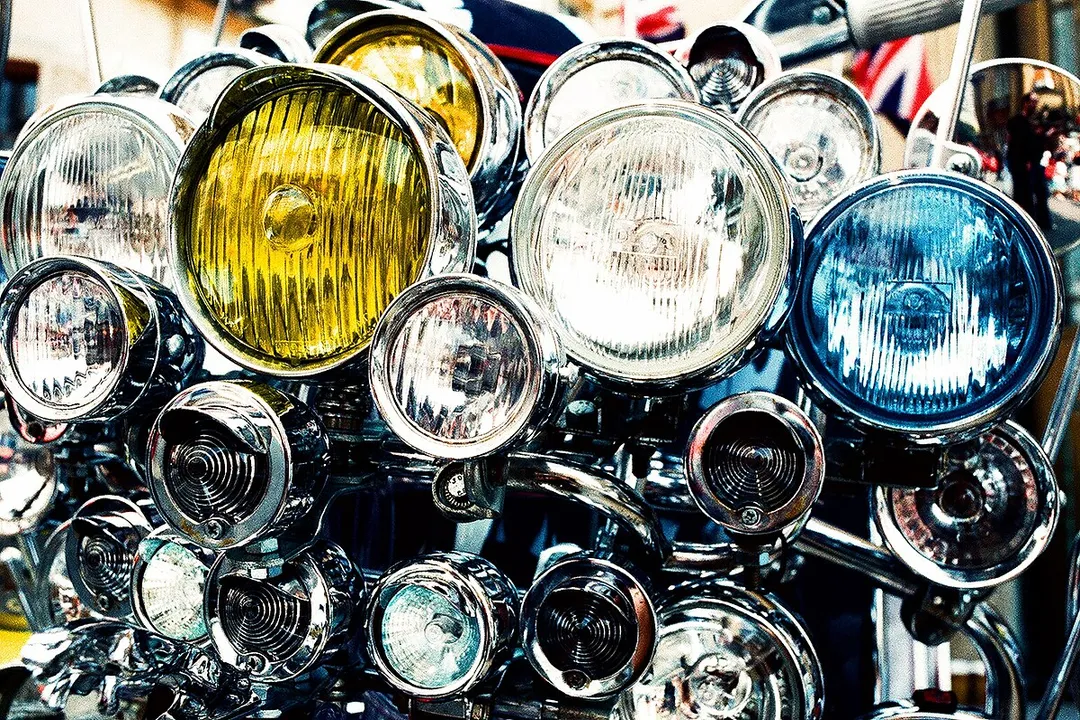 When were adaptive headlights invented?, Technological Refinements