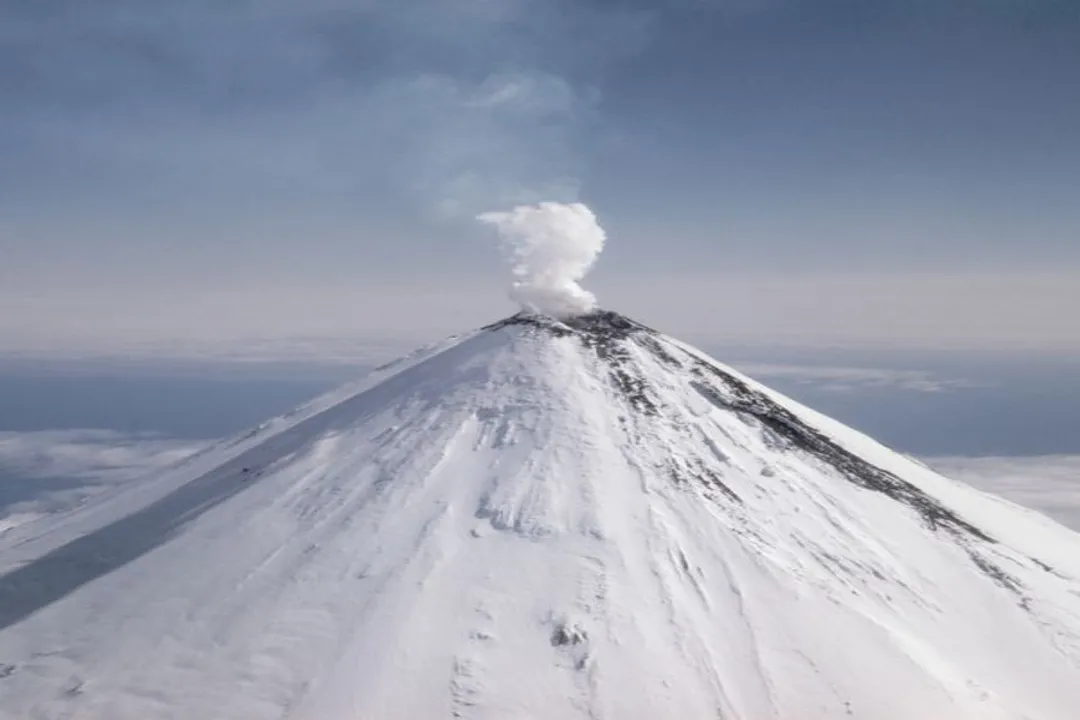 Why do volcanoes form at subduction zones?