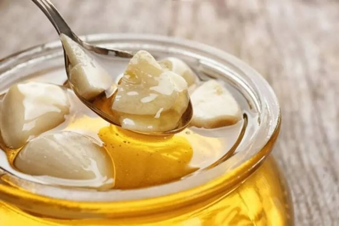 What enzyme converts alliin into allicin when the garlic bulb is crushed?