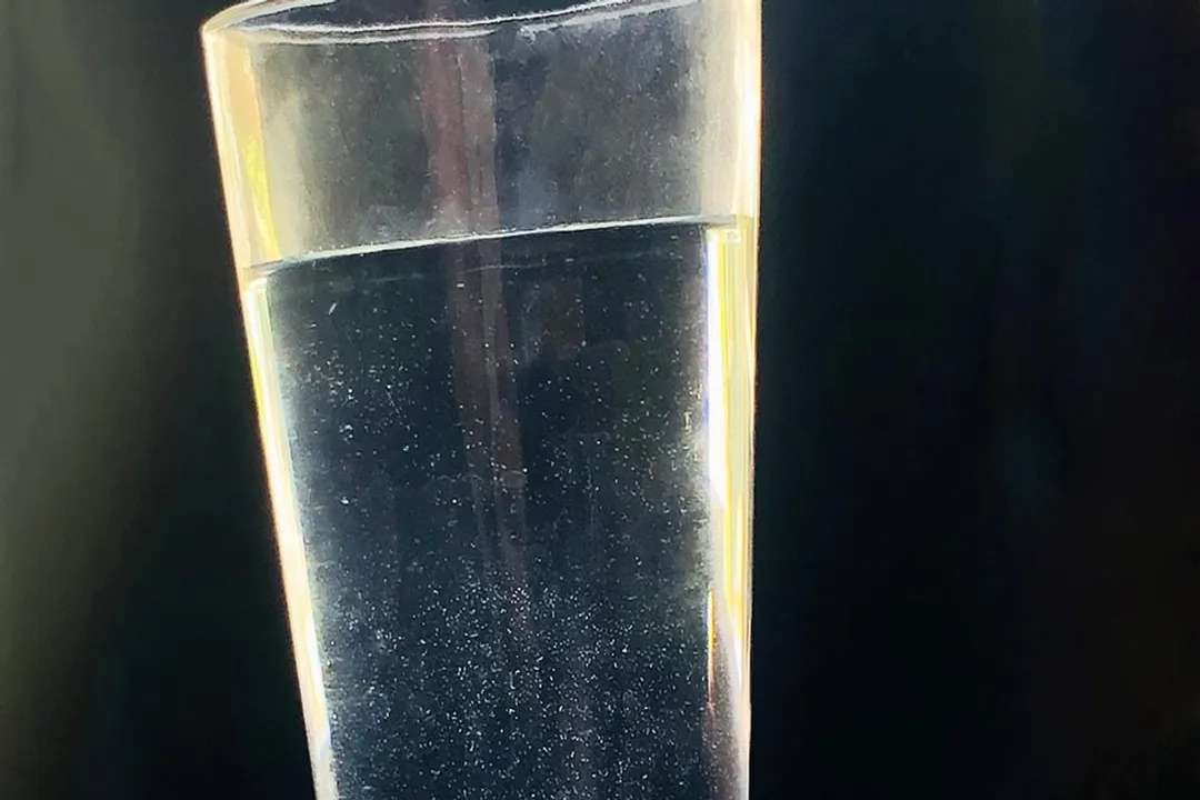 Is it okay to drink water with particles in it?
